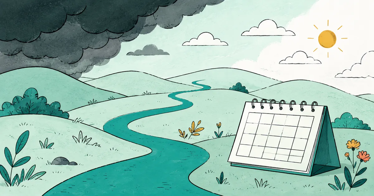A winding path through hills beside a blank calendar.