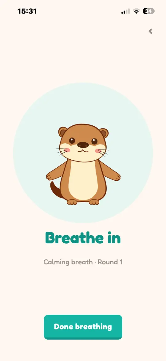 The breathing exercise in Loutra: the otter in a mint circle with the instruction Breathe in.